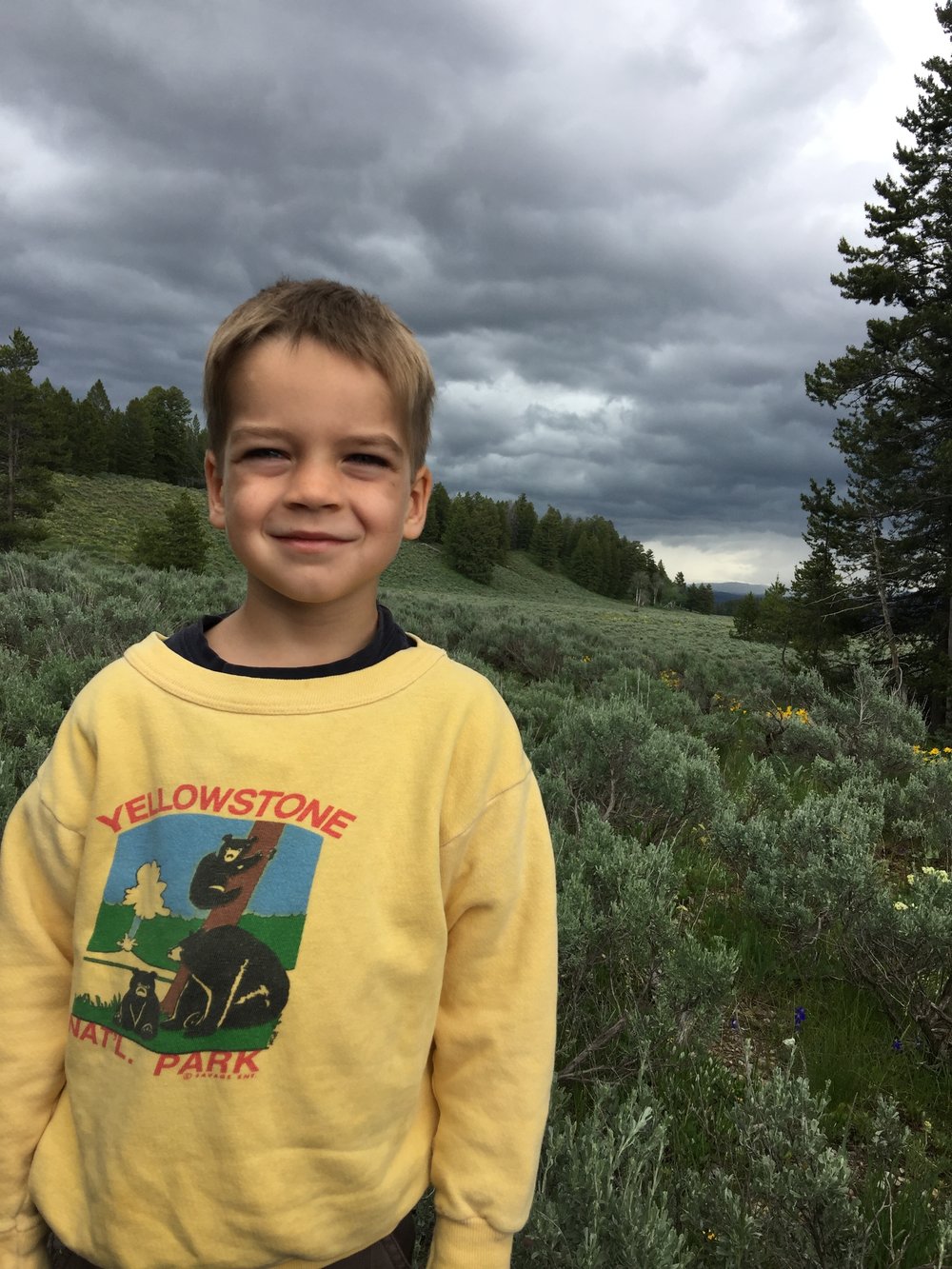  In his mom's old sweatshirt, with black bears in the background.&nbsp; We could see them with binoculars!&nbsp; GTNP 