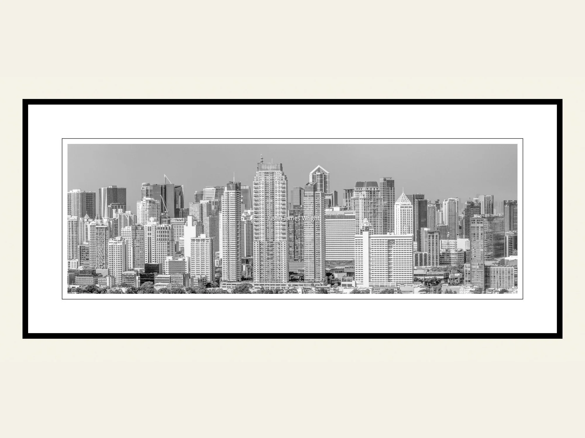 A framed black and white panoramic photography print of the skyline of the City of Makati, Philippines