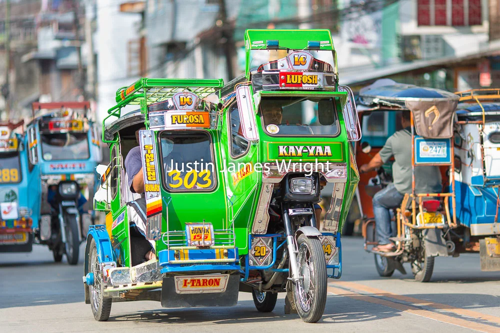 Colorful Tricycles, Bontoc, Mountain Province, Philippines Philippine Image # 4021 If you wish to purchase a photography print of this image, or would like to license this image please contact us using the form below. Please kindly include the Image Title and Image Ref # in your message, we will get back to you.
