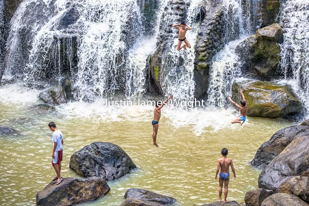 Children Jump Over a Waterfall, Cavinti, Laguna, Philippines Philippine Image # 4025 If you wish to purchase a photography print of this image, or would like to license this image please contact us using the form below. Please kindly include the Image Title and Image Ref # in your message, we will get back to you.