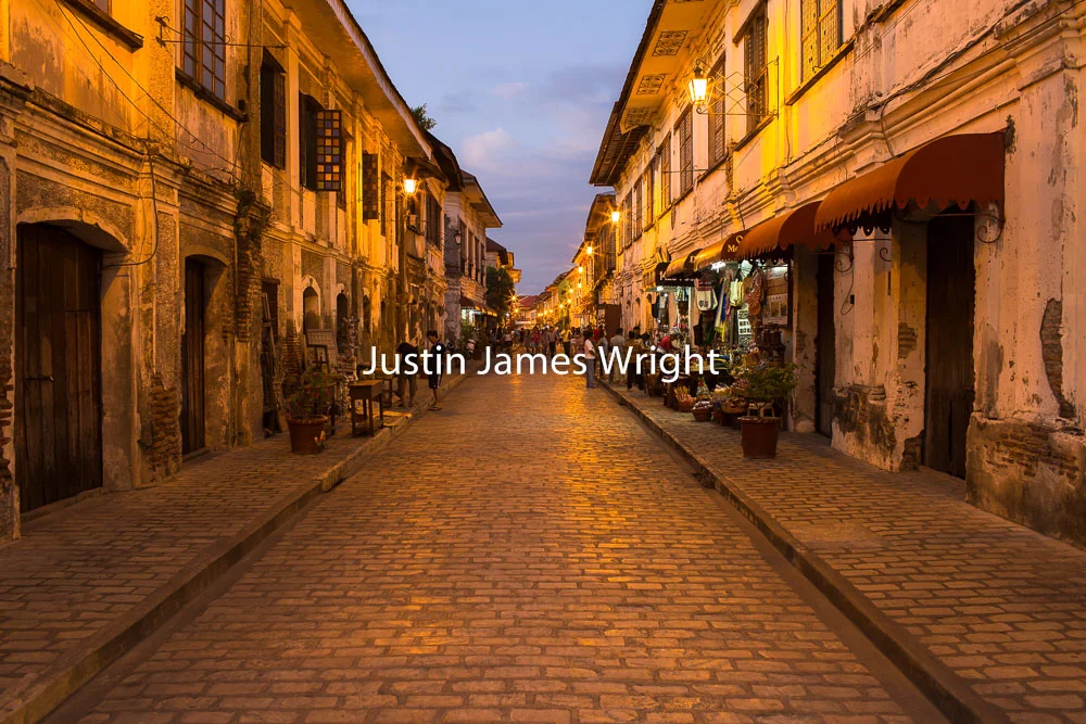 Calle Crisologo, Vigan, Ilocos Sur, Philippines A UNESCO World Heritage Site Philippine Image # 4158 If you wish to purchase a photography print of this image, or would like to license this image please contact us using the form below. Please kindly include the Image Title and Image Ref # in your message, we will get back to you.