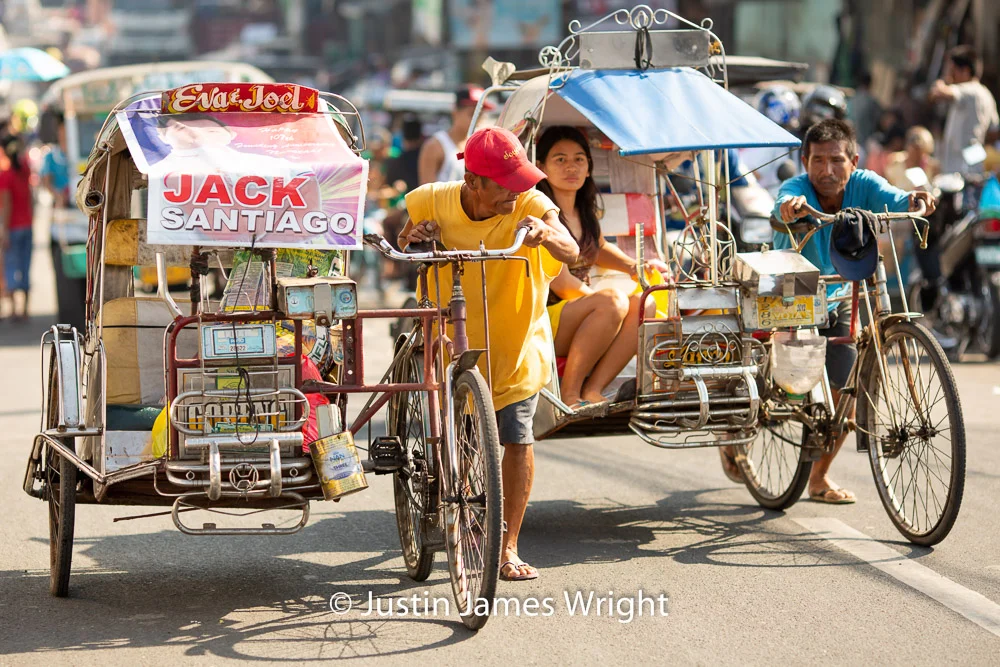 Pedicabs,, Malabon, Metro Manila, Philippines A popular means of Public Transport in the Philippines Philippine Image # 4198 If you wish to purchase a photography print of this image, or would like to license this image please contact us using the form below. Please kindly include the Image Title and Image Ref # in your message, we will get back to you.