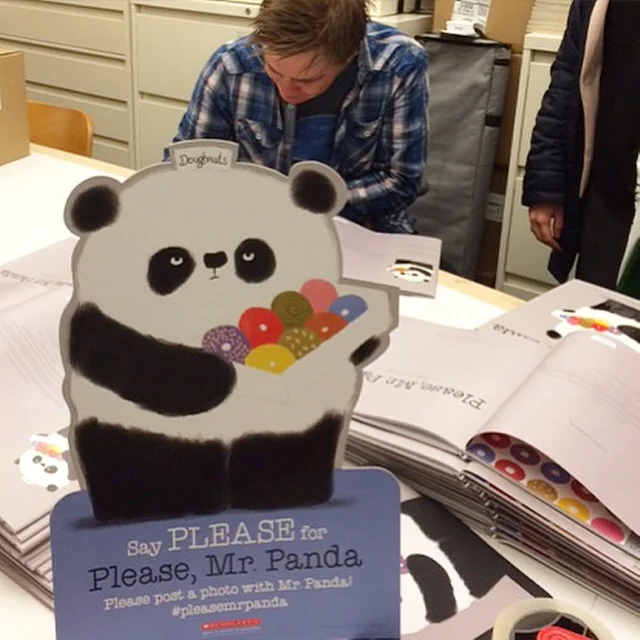 Signing books in Scholastic 