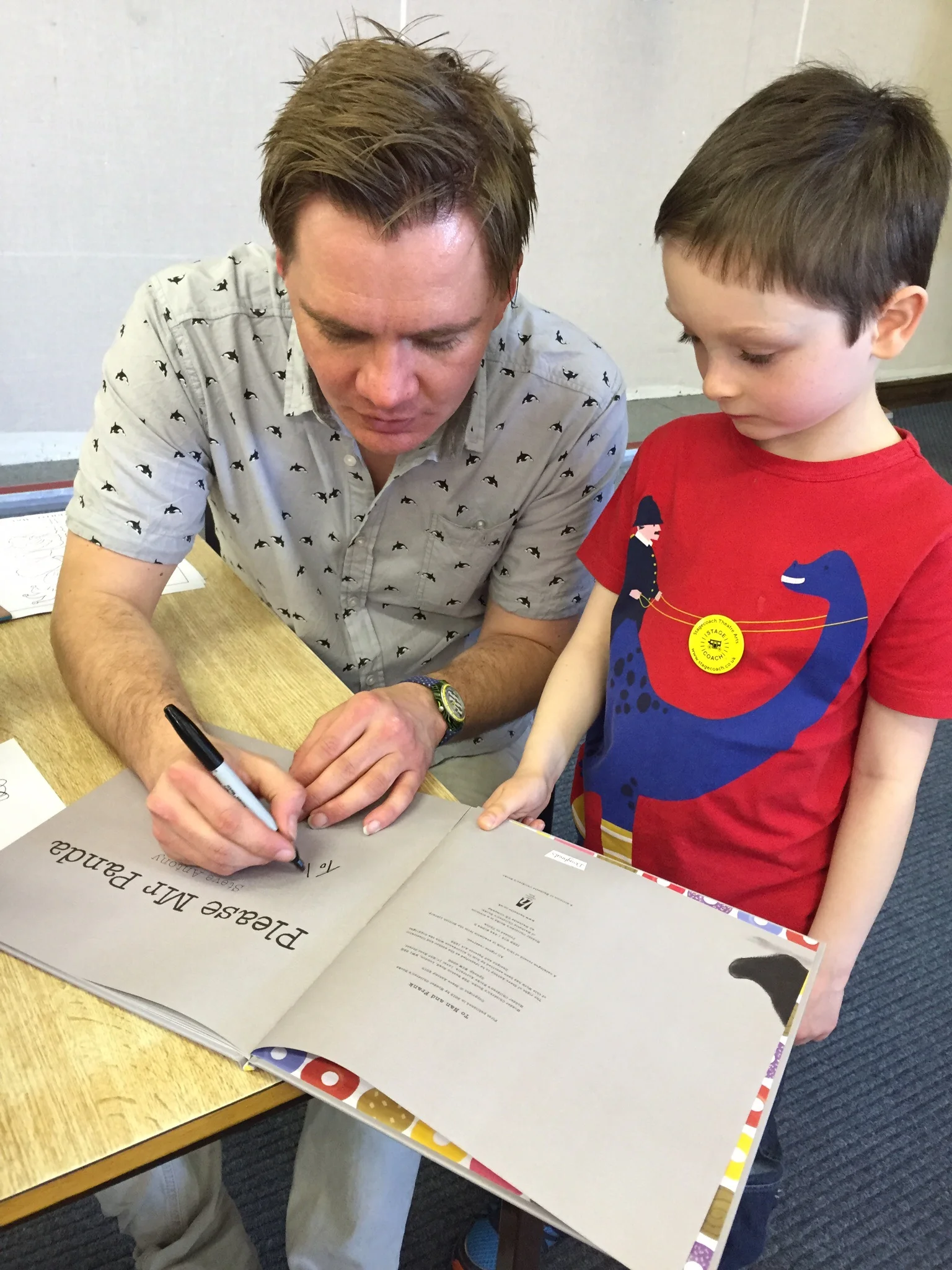 Signing a book for Harry.