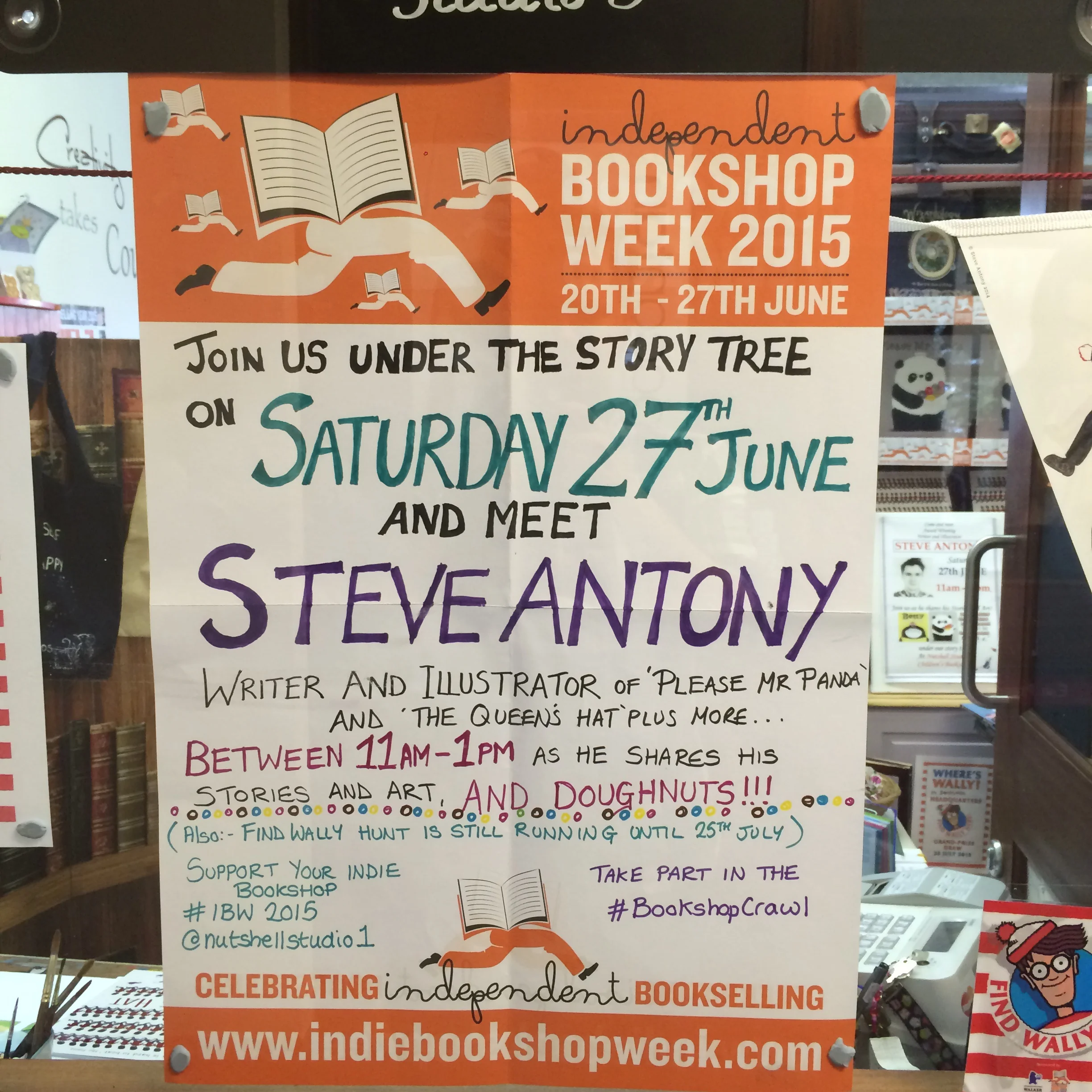 Signage featuring the Independent Booksellers Week hashtags.