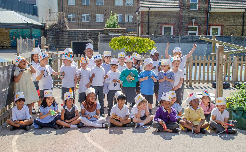The two Reception classes marched around the playground wearing their especially made hats. (Photo by Emerson Wimsey)
