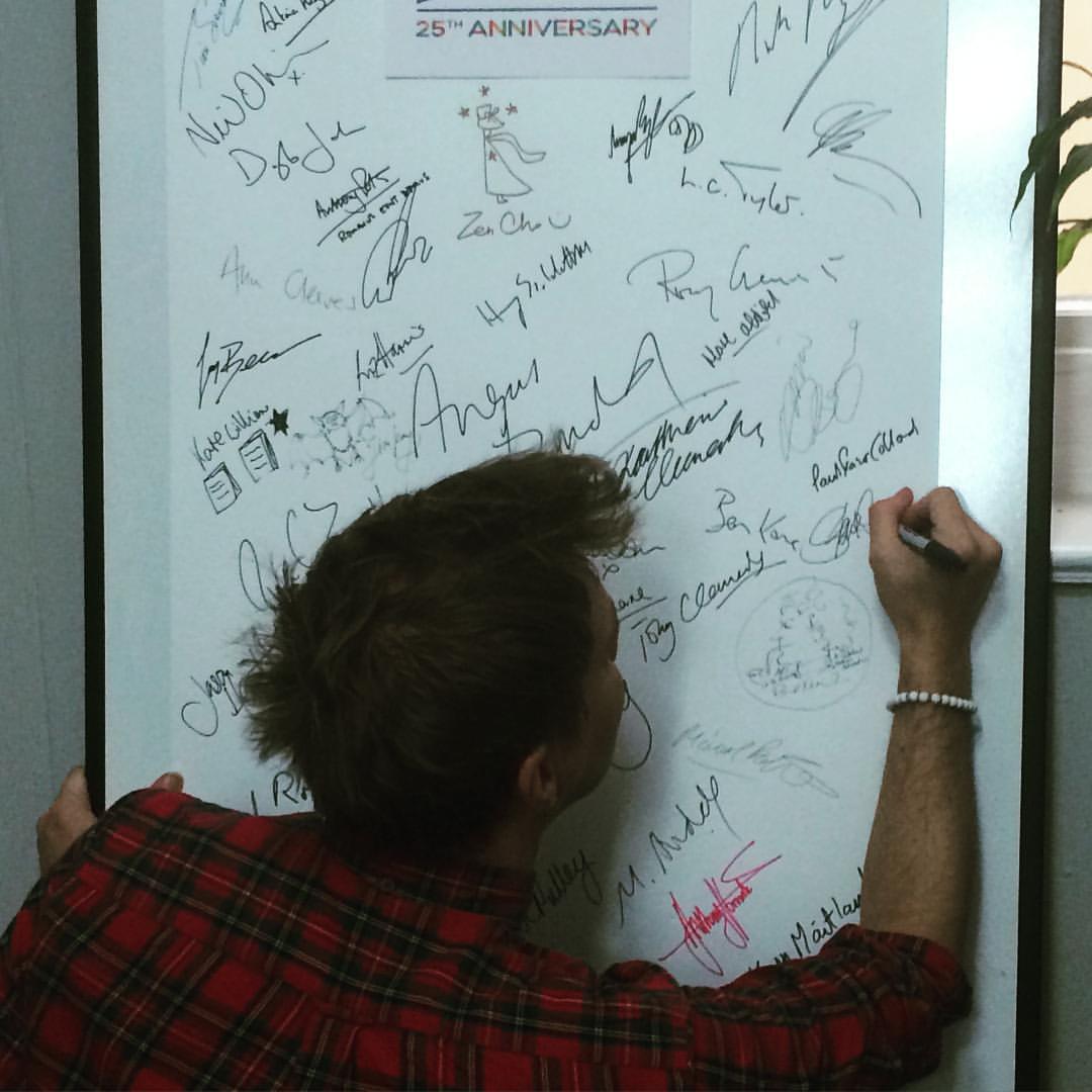 Making my mark on a big page of signatures.