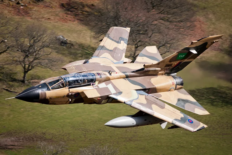 The pilot starts to swing the wings back to 63 degrees, the wings can't go back fully swept due to the big 'hindenburger' fuel tanks. 