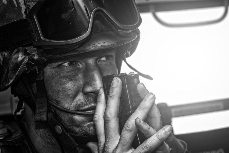 UPF soldier gripping a spare magazine between his hands, just before we land at the landing area.