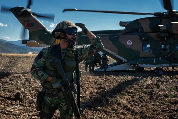 A UPF soldier recalls everyone as the last casualty is loaded in to the helicopter. 