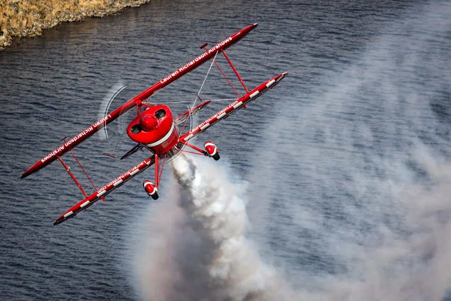 Lauren Richardson in her Pitts S-1S special over the water at Craig Goch reservoir. 