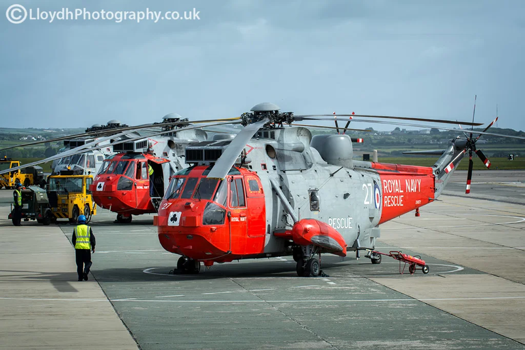 Two 771 NAS Sea King Mk5s on the dispersal at RNAS Culdrose and a 'bagger' ASaC Mk7 Sea King.