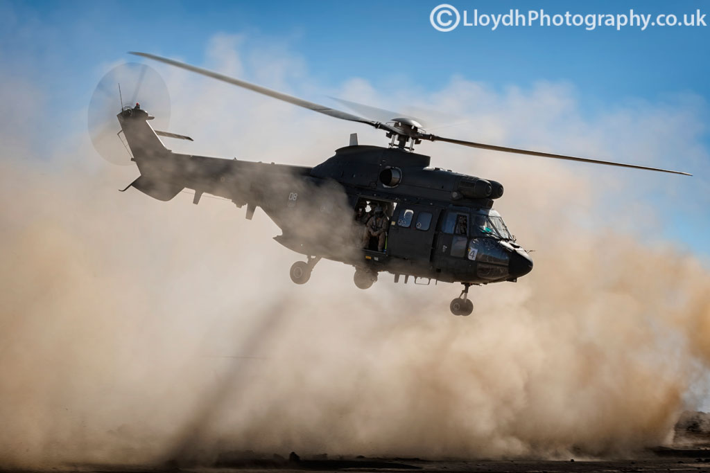 The kind of environment the D500 had to put up with, dust everywhere as this AS332B Super Puma gets airborne with a full load out of troops.