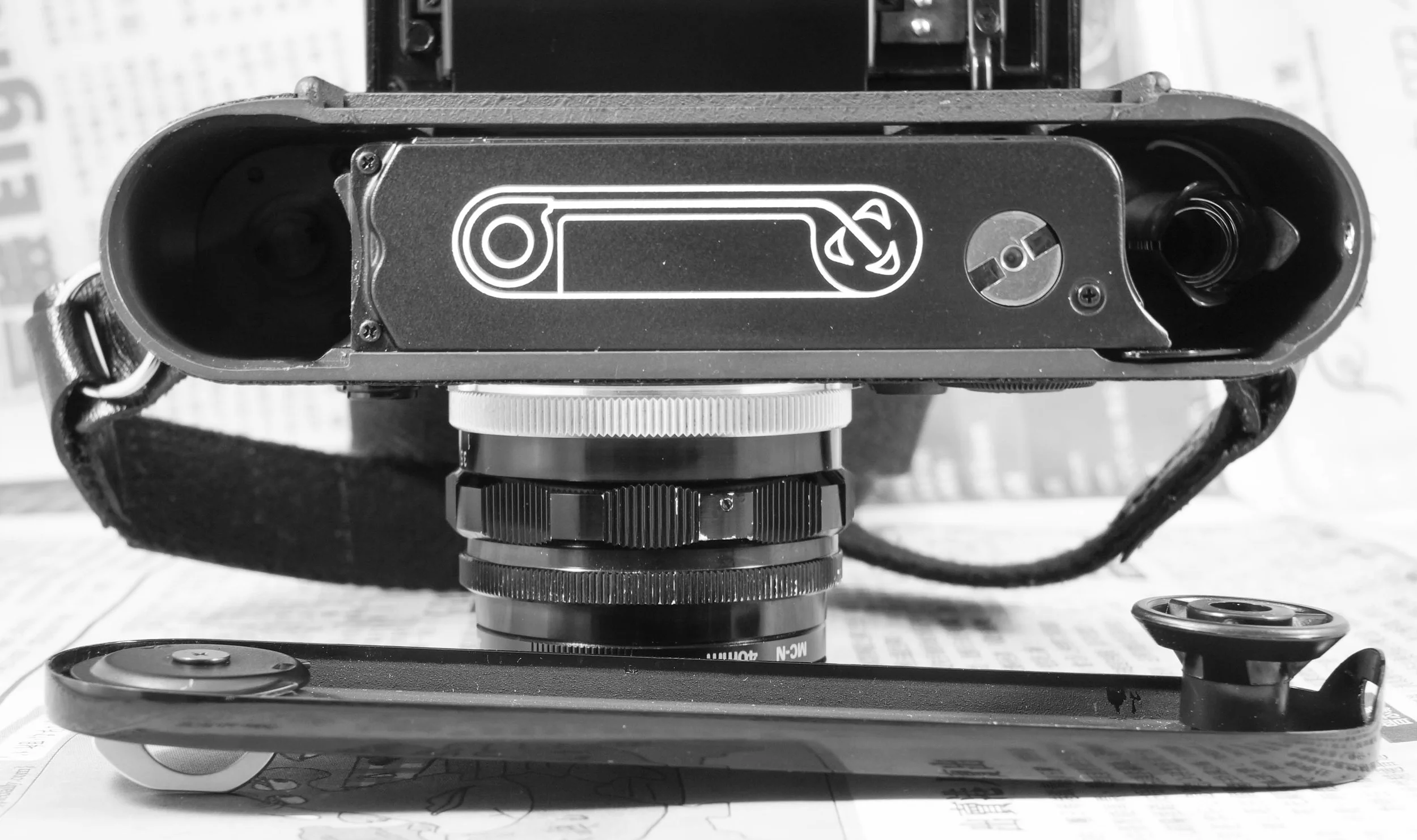 M6 loading mechanism. The film leader has to go into the middle of the 3-prong spindle.
