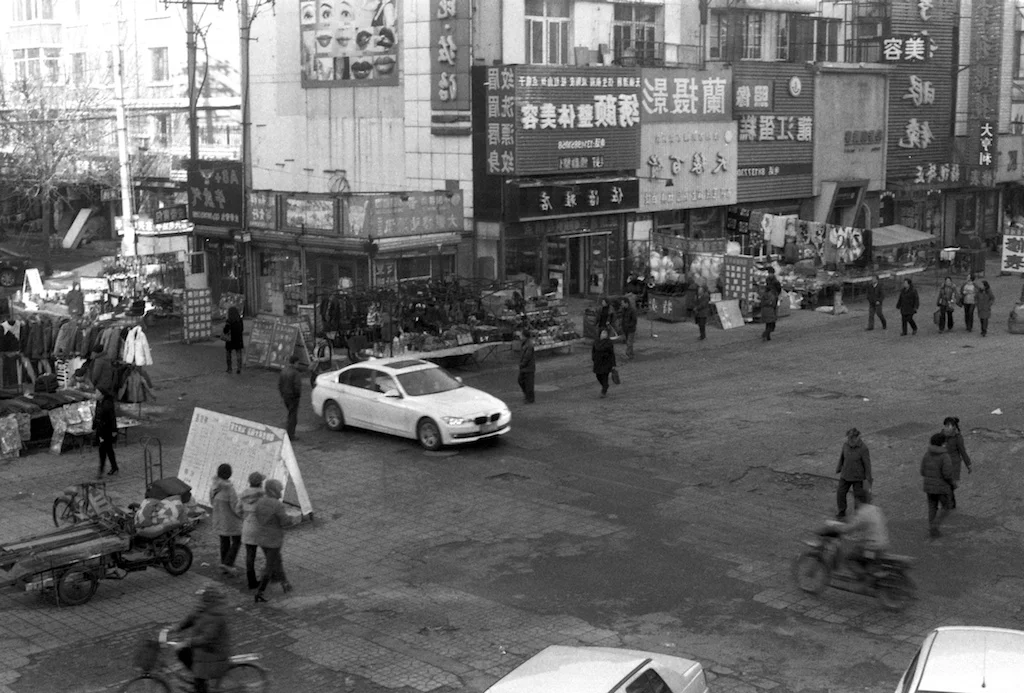 Commercial Cross | Fm2n with 28mm Itorex + Ilford Pan 100 | by Xue Rui