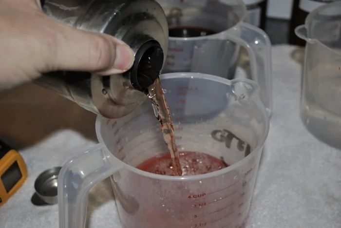 Pouring the developer back into a jug at the end of the 3.5 minutes. It'll go back into the storage bottle once the blix is in.