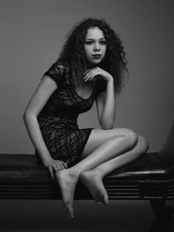 2 light setup. Softbox placed to camera right. Umbrella placed just to camera left for fill light. Ilford Pan F Plus.