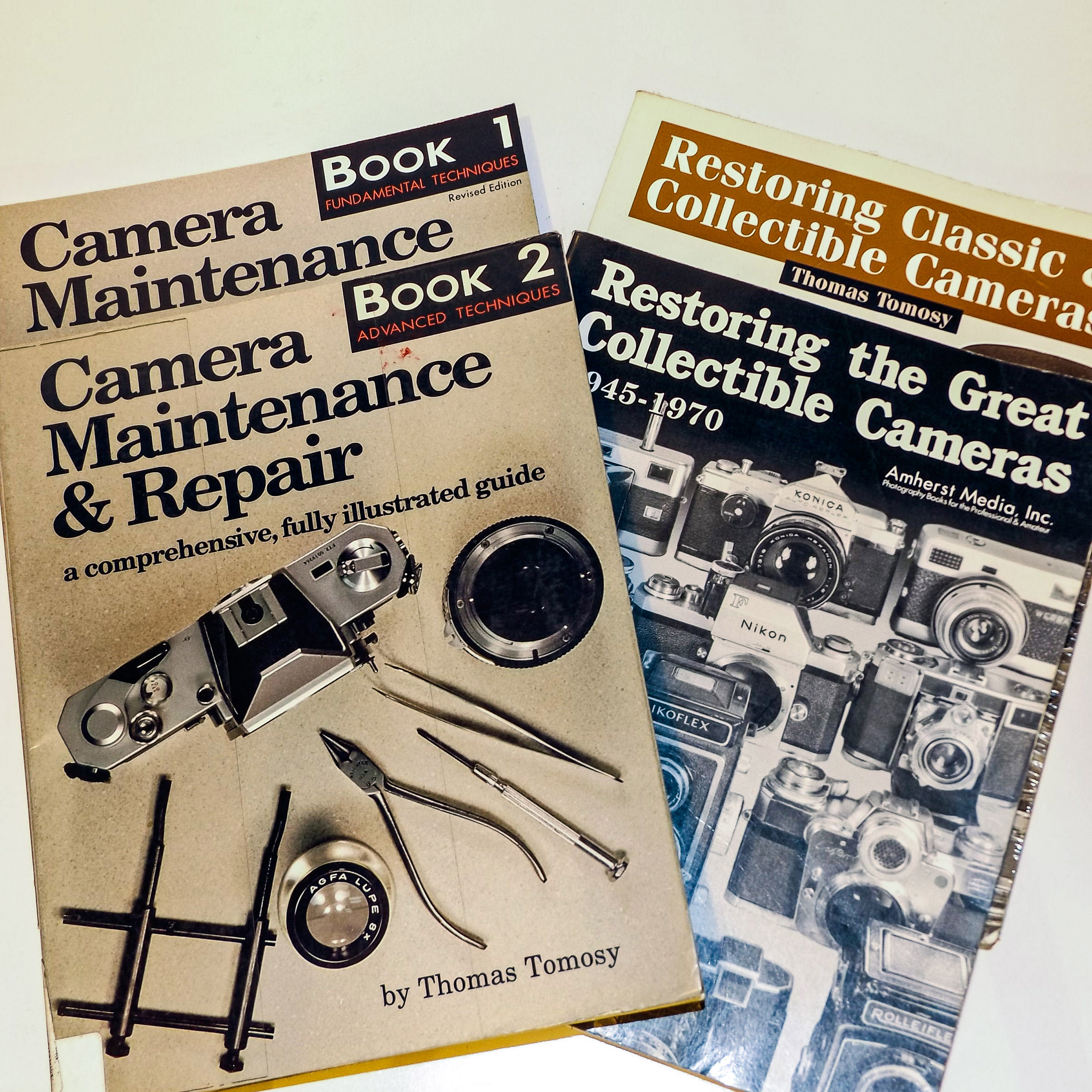 Tomosy’s Book 1 & 2 will get you started—his subsequent restoring books build on these and have many chapters specifically for particular classics. Other titles, including Nikon and Leica, are also available.