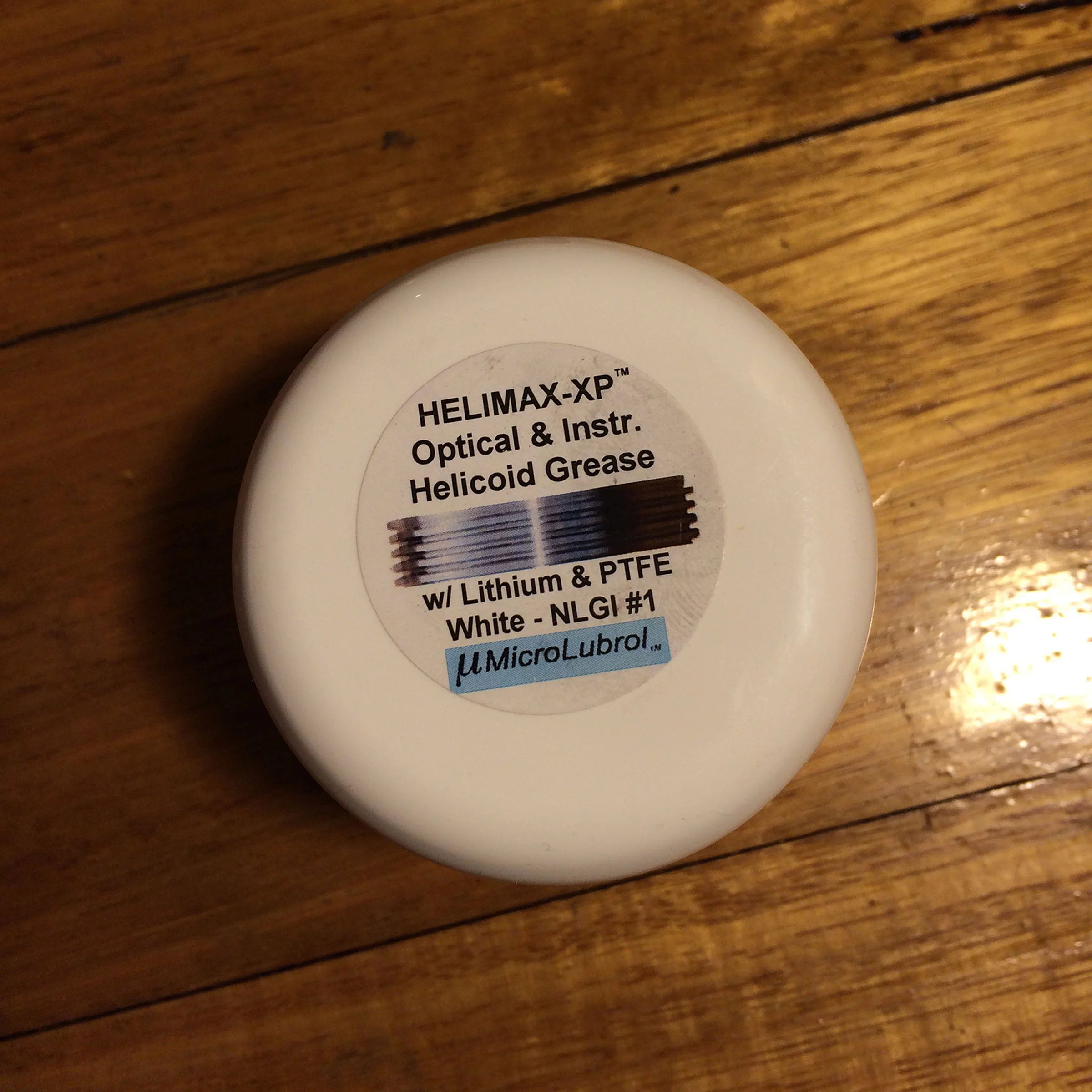 I’ve found the following grease, which is available here from eBay to be both ideally suited to lens lubrication, and affordable—traits which, frequently, do not go hand in hand!