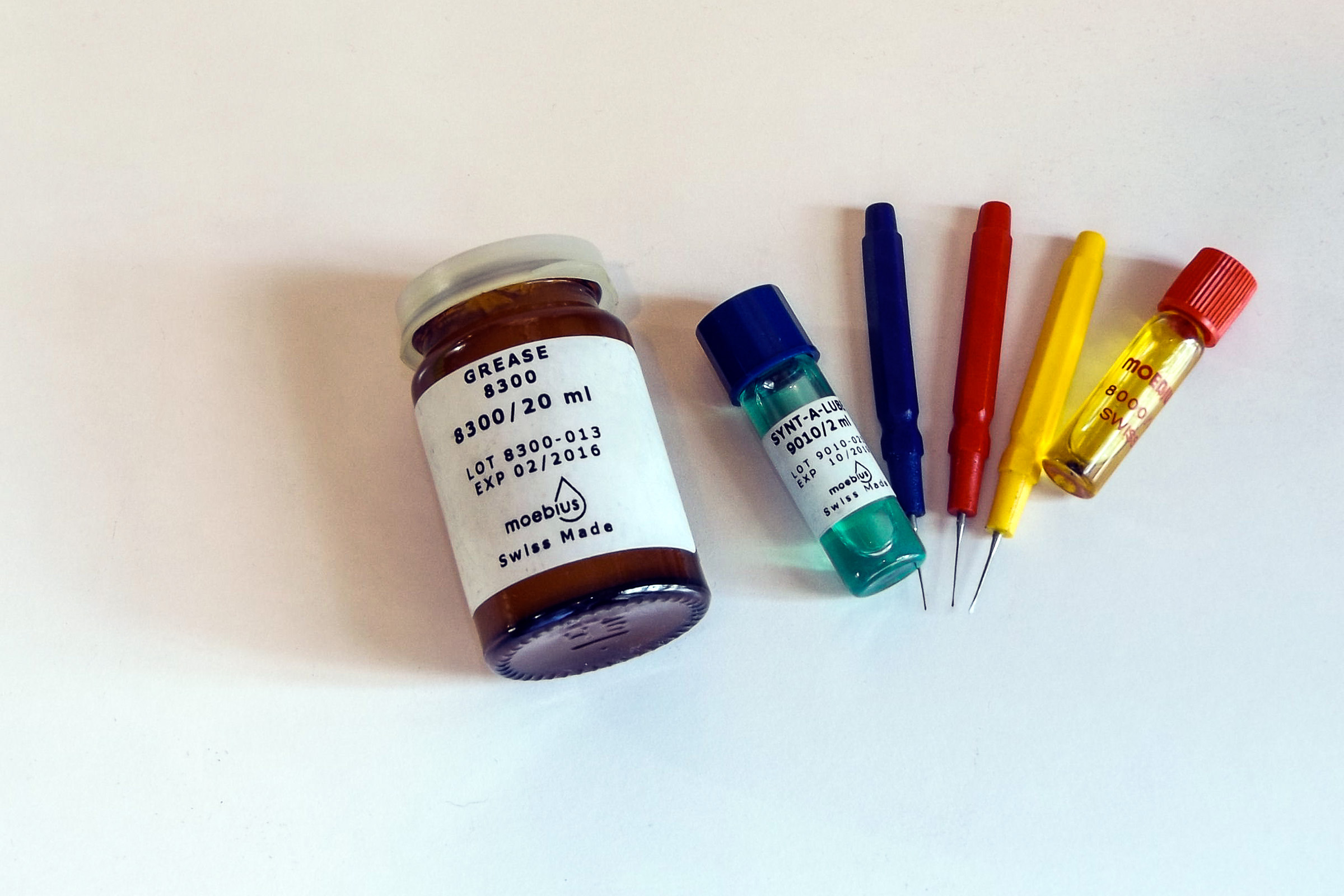 A selection of Moebius lubricants I keep in stock specifically for lubricating camera mechanisms. The three coloured objects with needle-like tips are oilers, made for dabbing minute quantities of oil precisely where desired.