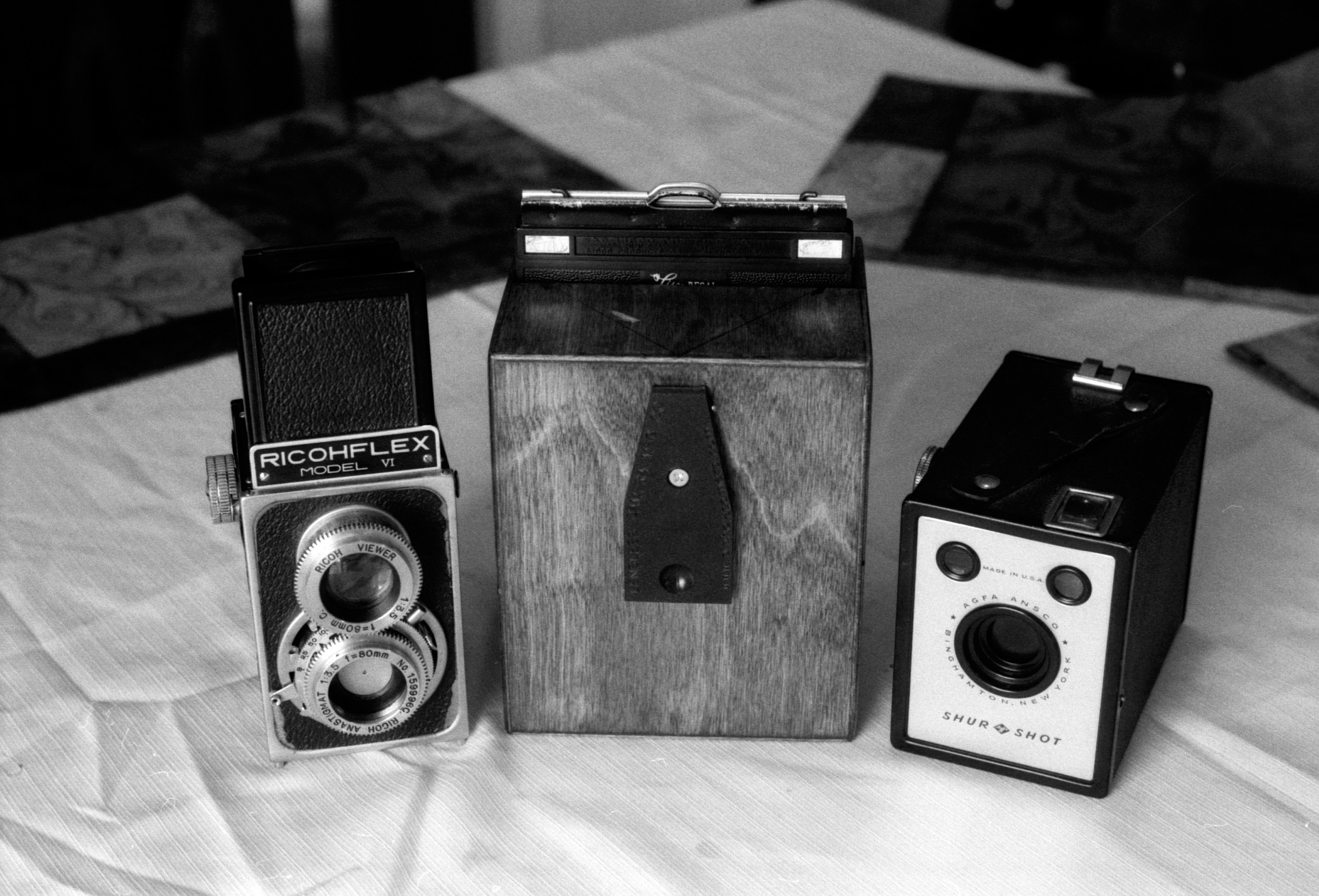 In the middle isthe 4x5 camera used to make my photos, Lensless Camera co. 4x5 pinhole.