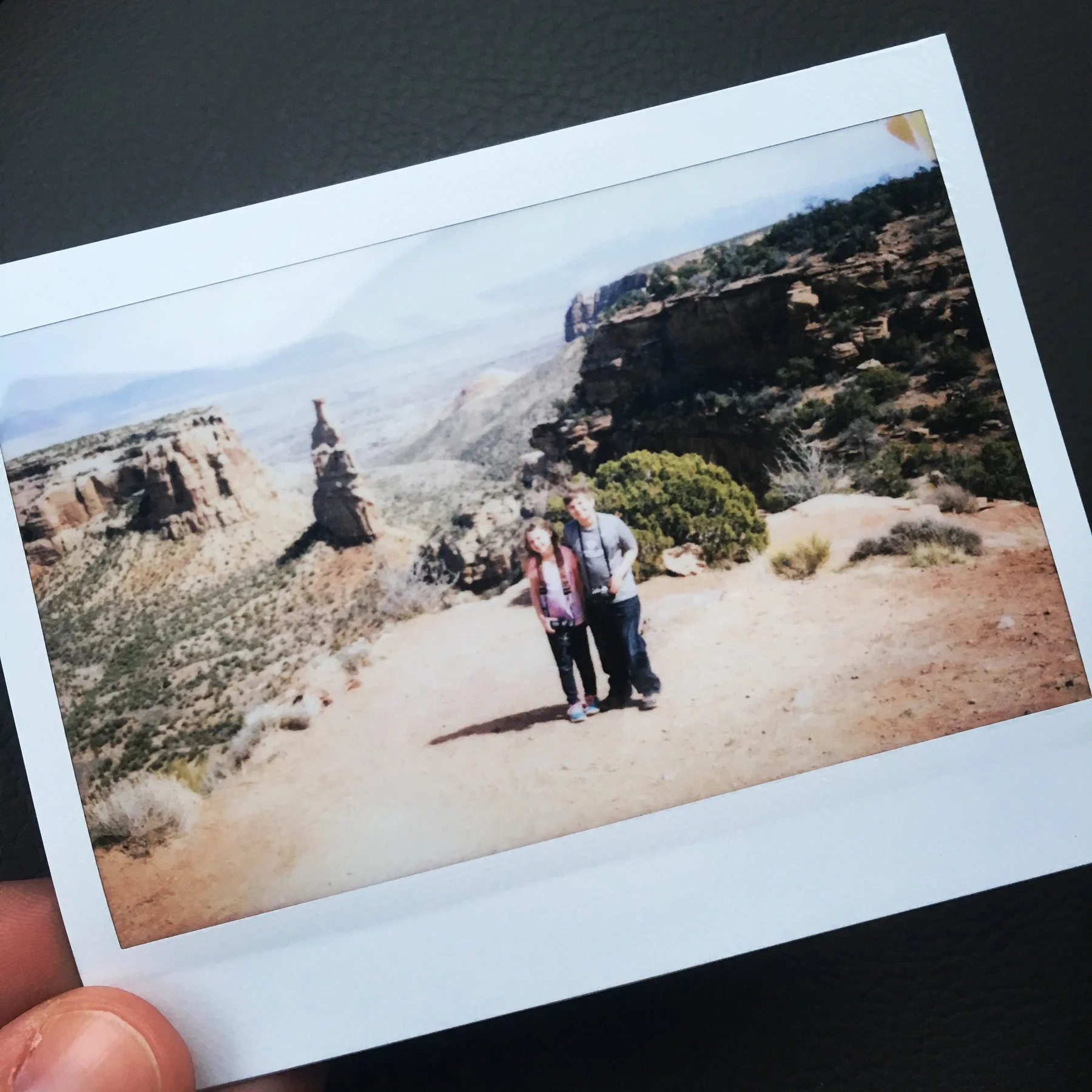 Instax of Michael and Celia at the Colorado Monument. 