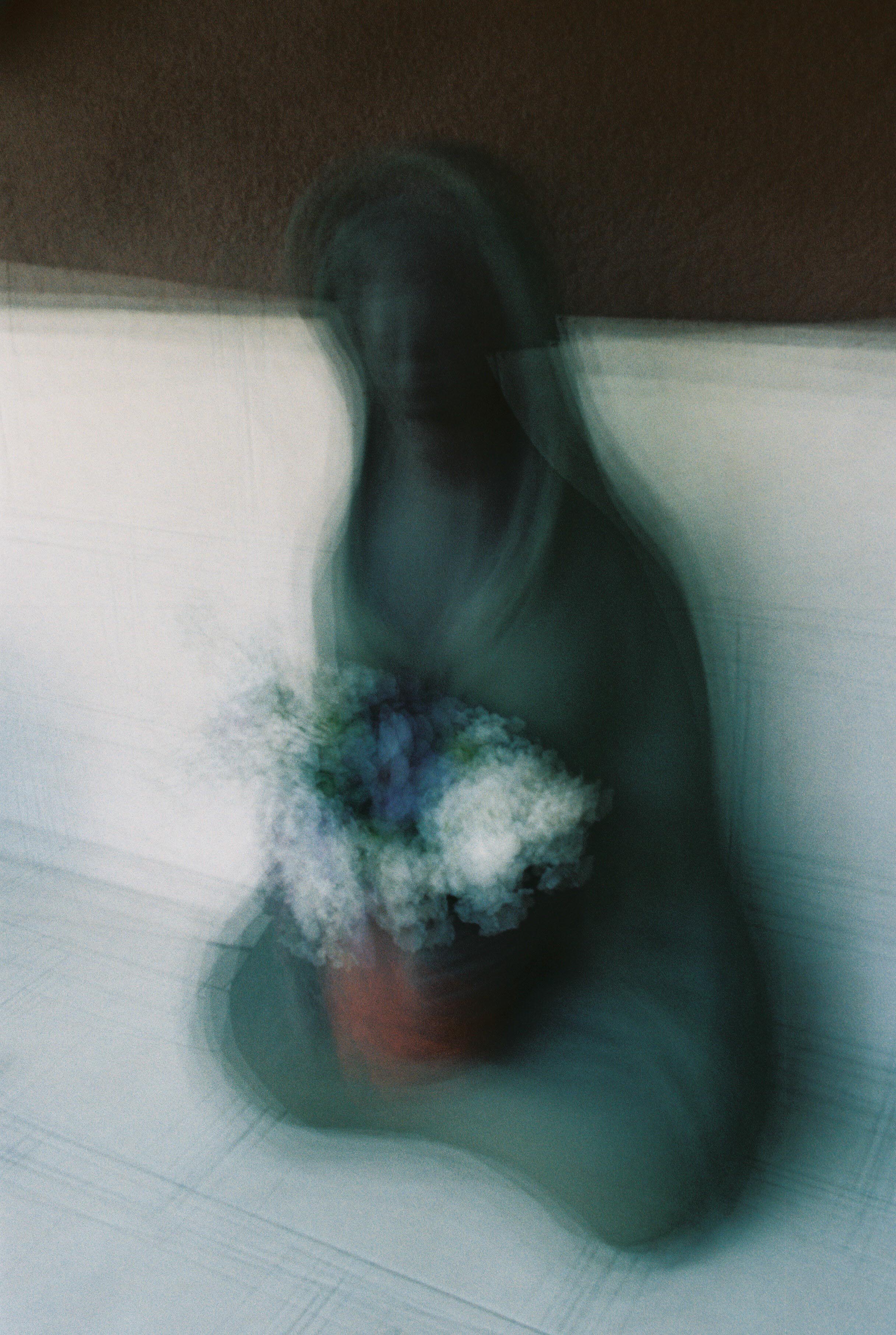 Efrain Bojorquez | Woman with flowers | Canon AE-1 Program | Kodak ProImage 100