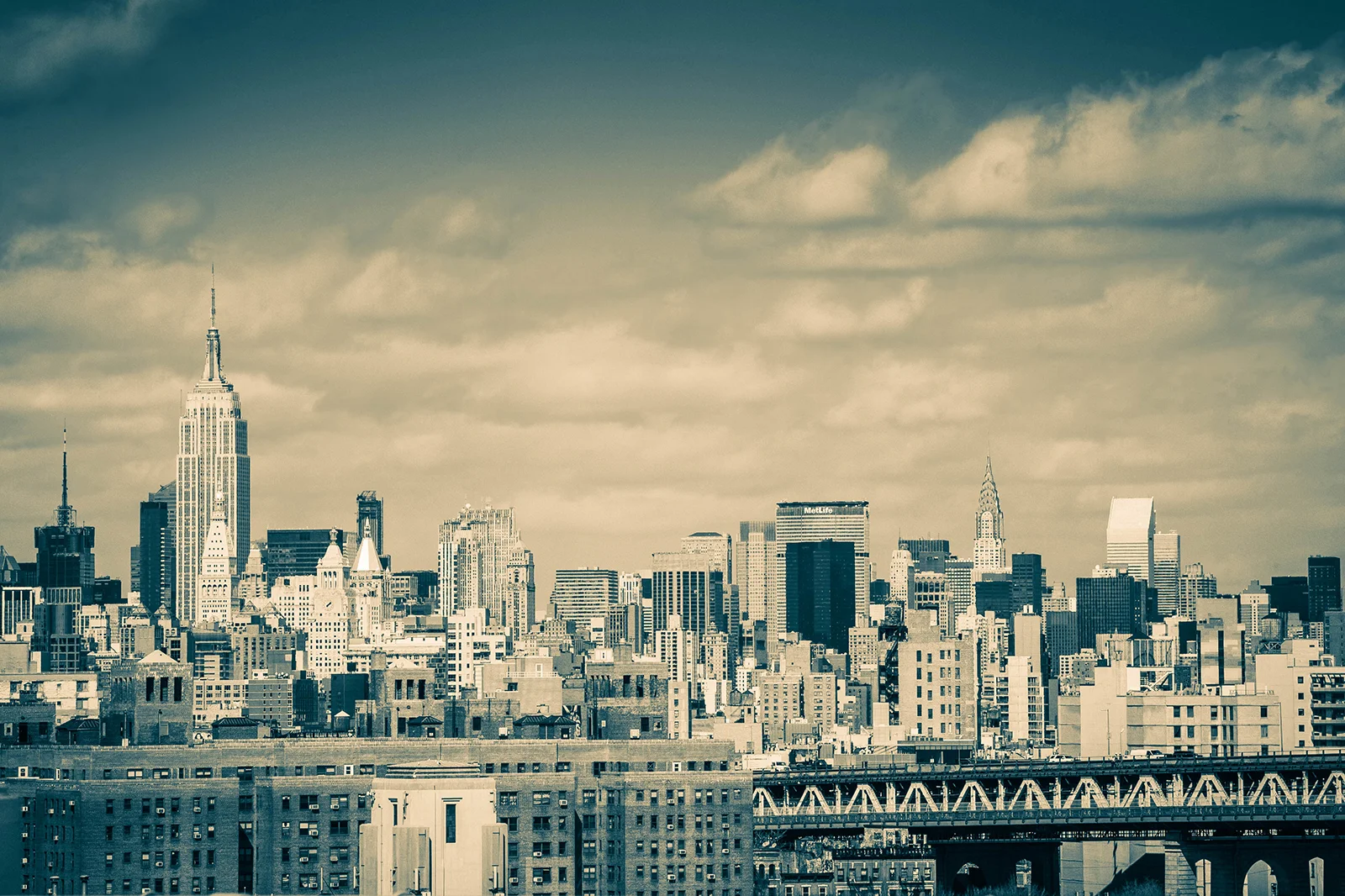 View of the Empire State and Chrysler buildings from the Brooklyn Bridge