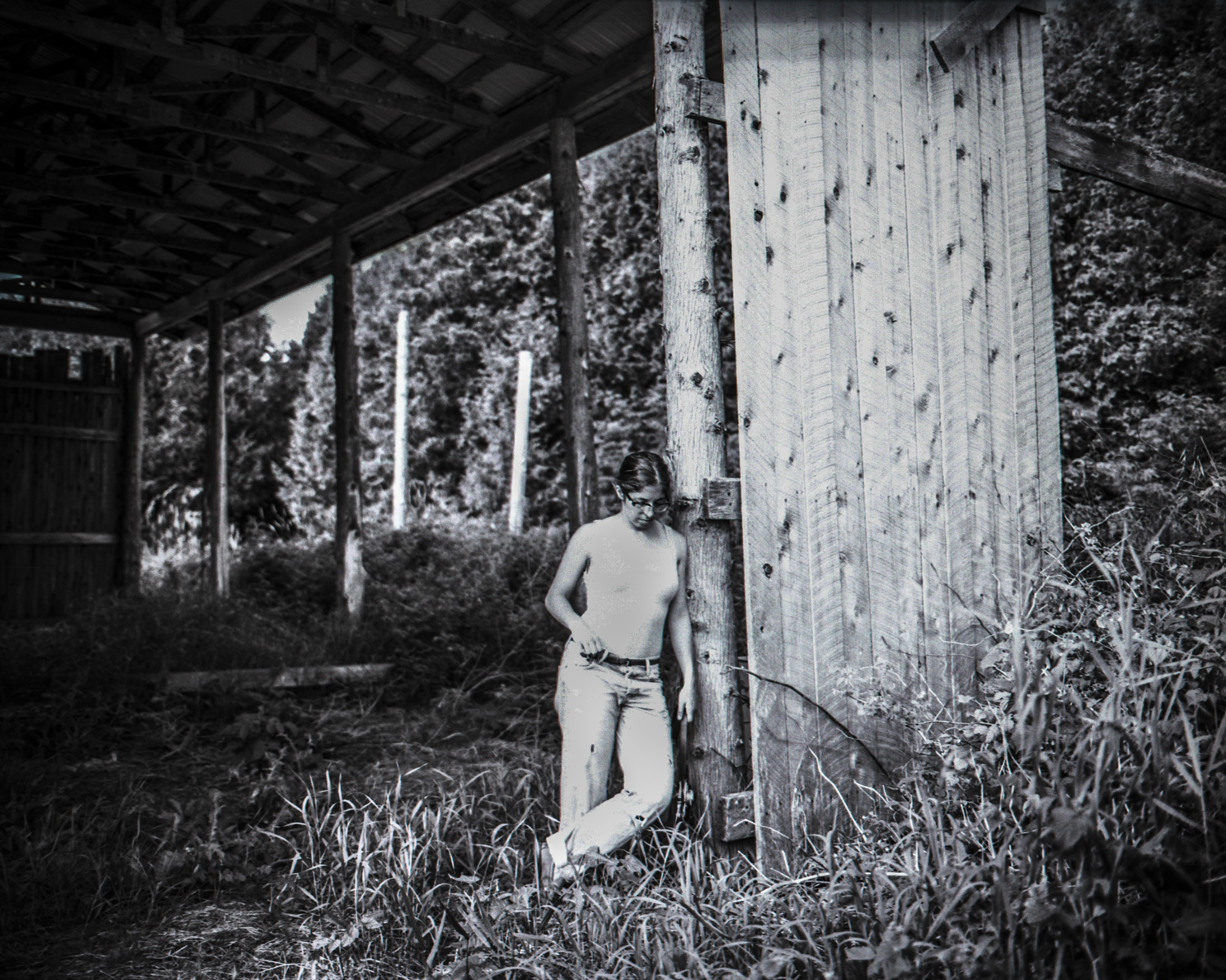 Vanessa rests against the frame of an aging barn on Manitoulin Island.