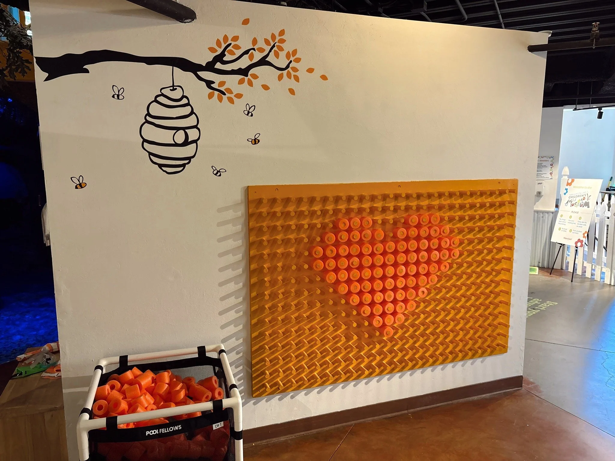Check out our new Hive-Themed Noodle Art Wall! 🐝Inspired by this summer's bee-themed programming, children can create their own colorful hive designs. It's a fun, hands-on way to explore creativity while celebrating our favorite pollinators! 🍯🌼
