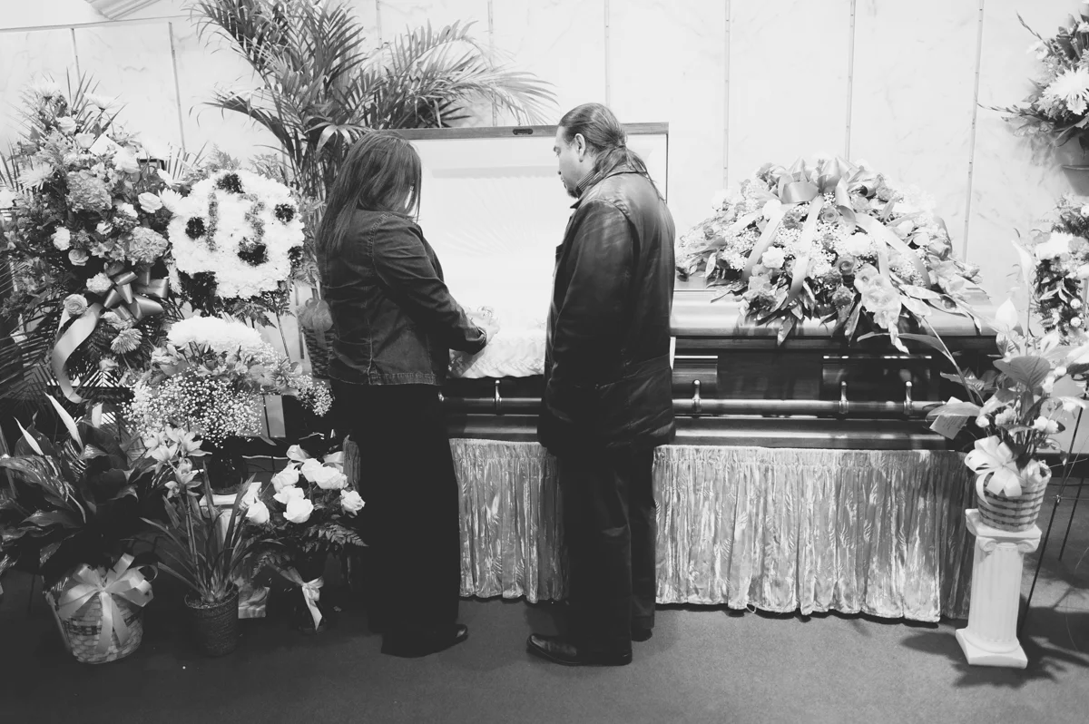 Mother and Father standing by their son for their final hour