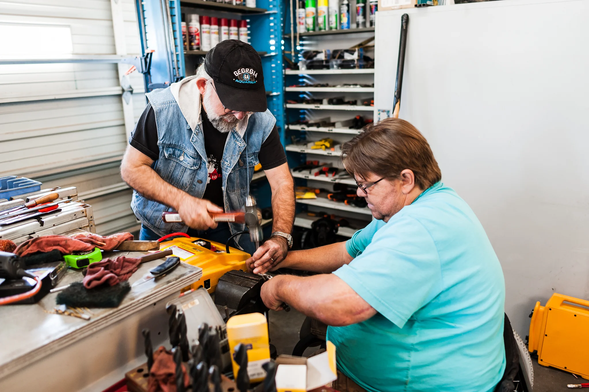 Robert and Tony modifying a batter pack to use on the golf carts.
