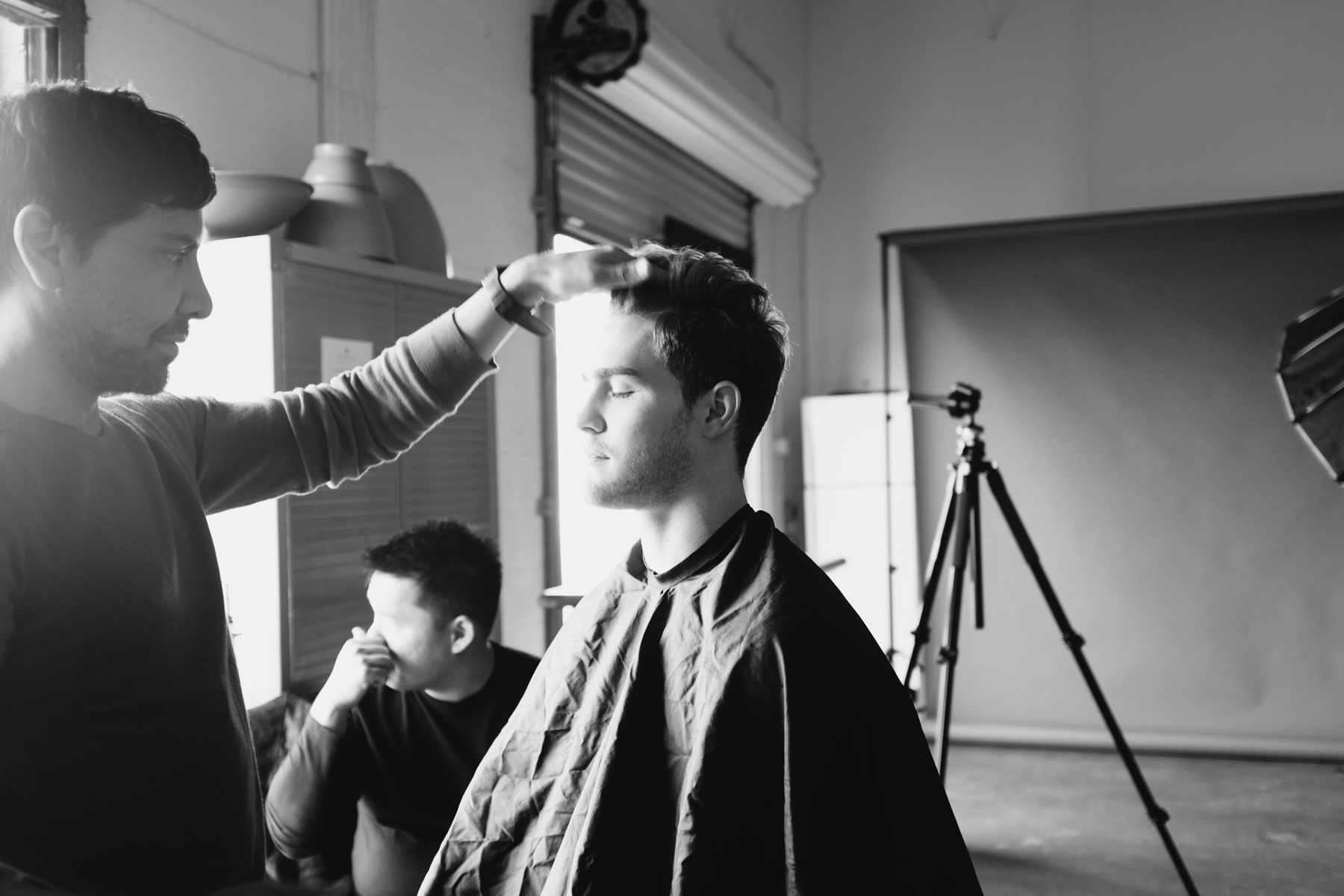 Ricky putting finishing touches on Clay's hair and makeup.