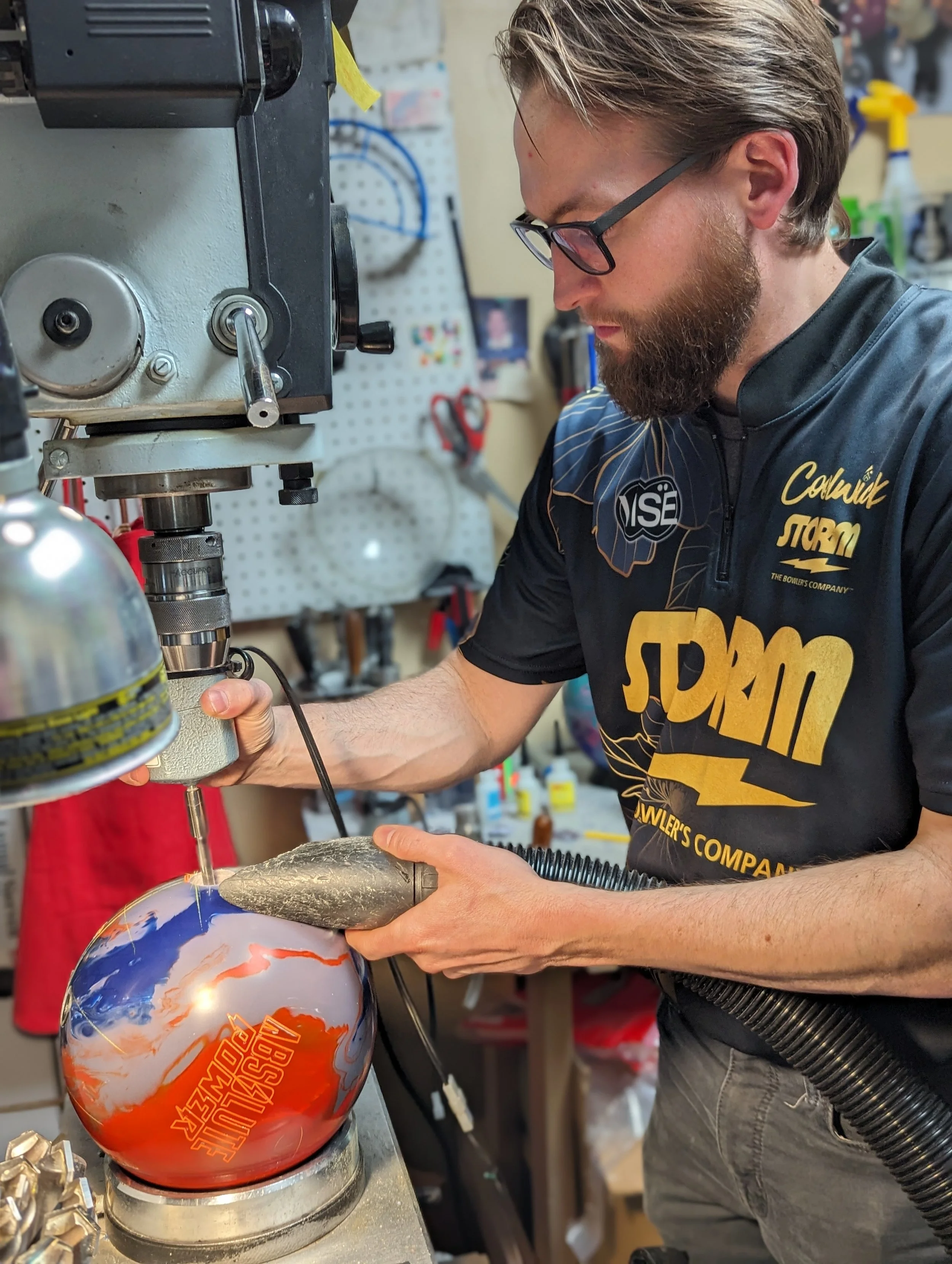 Adam drilling a bowling ball at Eastway Pro Shop at Eastway Bowl