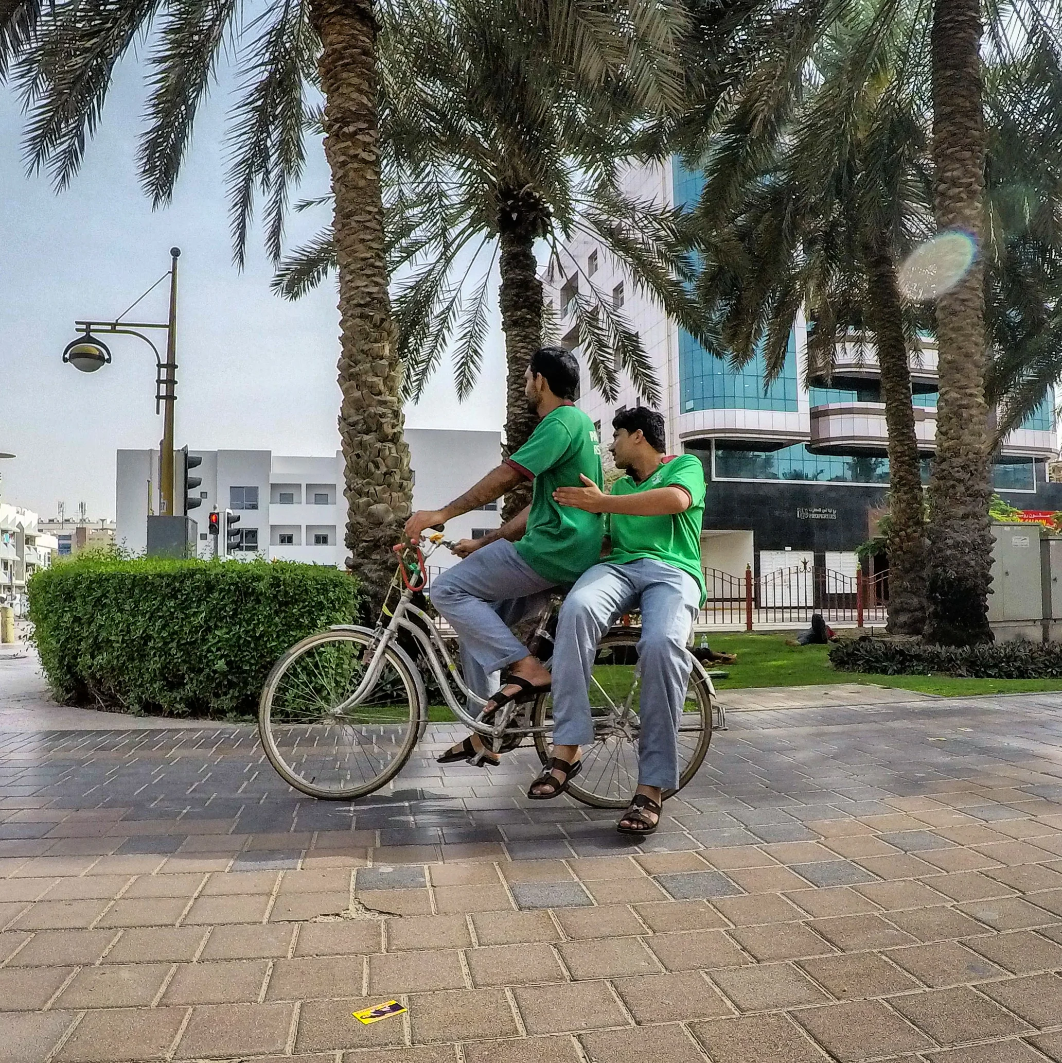 Beats walking, Cyclists riding through park, Deira, Dubai UAE
