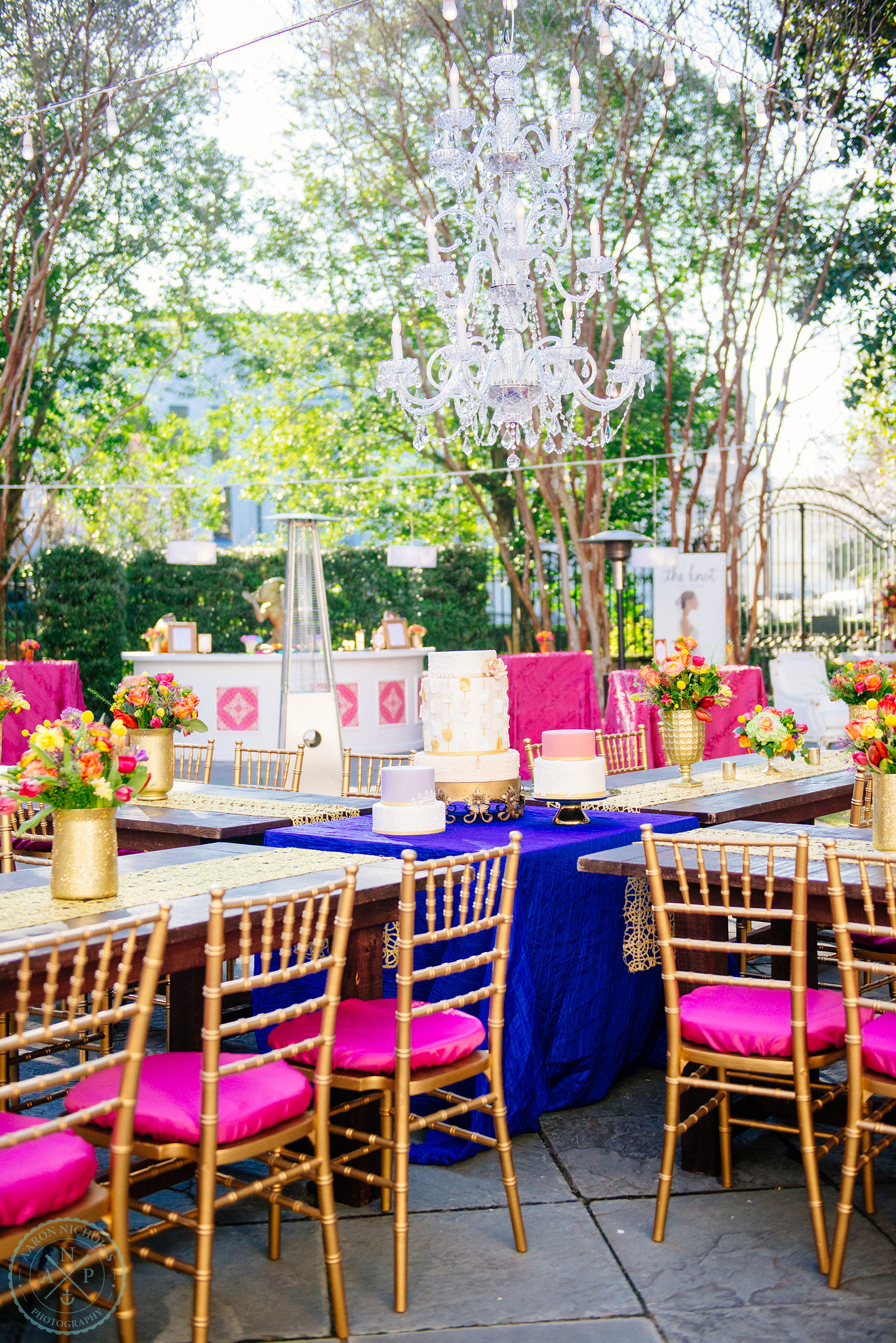 moroccan-blue-fuchsia-chandelier-garden-reception-gold-accents-pure-luxe bride
