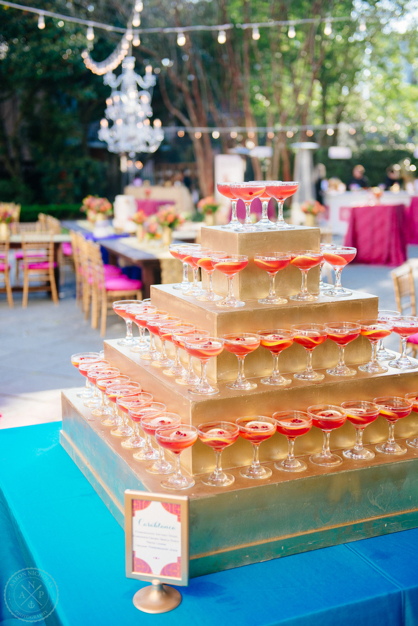 casablanca-style-champange-pyramid-with-sangria-moroccan-inspired-garden-wedding-reception-fuchsia-blue-orange-details