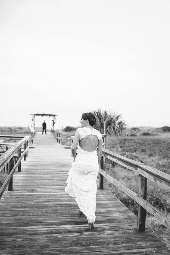 bride-walking-to-groom-for-first-look-wrightsville-beach-wedding-painter-ben-keys