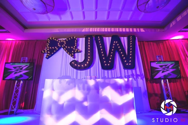 custom-marquee-lights-initials-and-bow-dj-booth-fuchsia-and-white-carpet