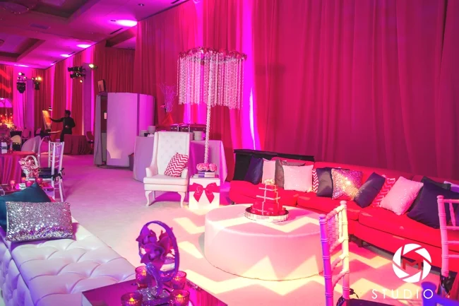 kids-lounge-bat-mitzvah-glitter-pillows-white-carpet-fuchsia-drapes-boxes-and-bows-crystals