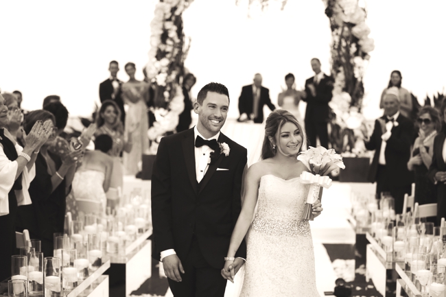 the-breakers-palm-beach-bride-carolina-herrera-sara-renee-events-miami-groom-candle-aisle-chuppah-on-the-beach