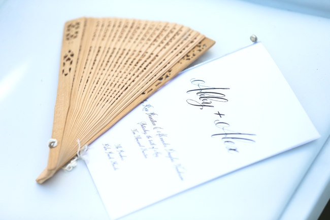 donna-newman-photography-the-breakers-wedding-luxury-program-with-wooden-fan-for-guests-on-hot-wedding-day-beautiful-touch-miami-palm-beach-wedding