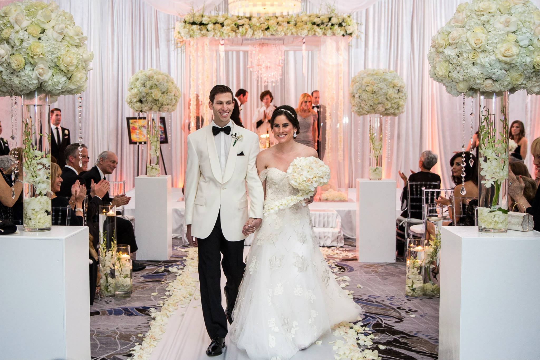 mr-and-mrs-boca-raton-polo-club-luxe-wedding-florals-chuppah-with-chandeliers-and-hanging-flowers-monique-lhuillier-gown-candle-ceremony