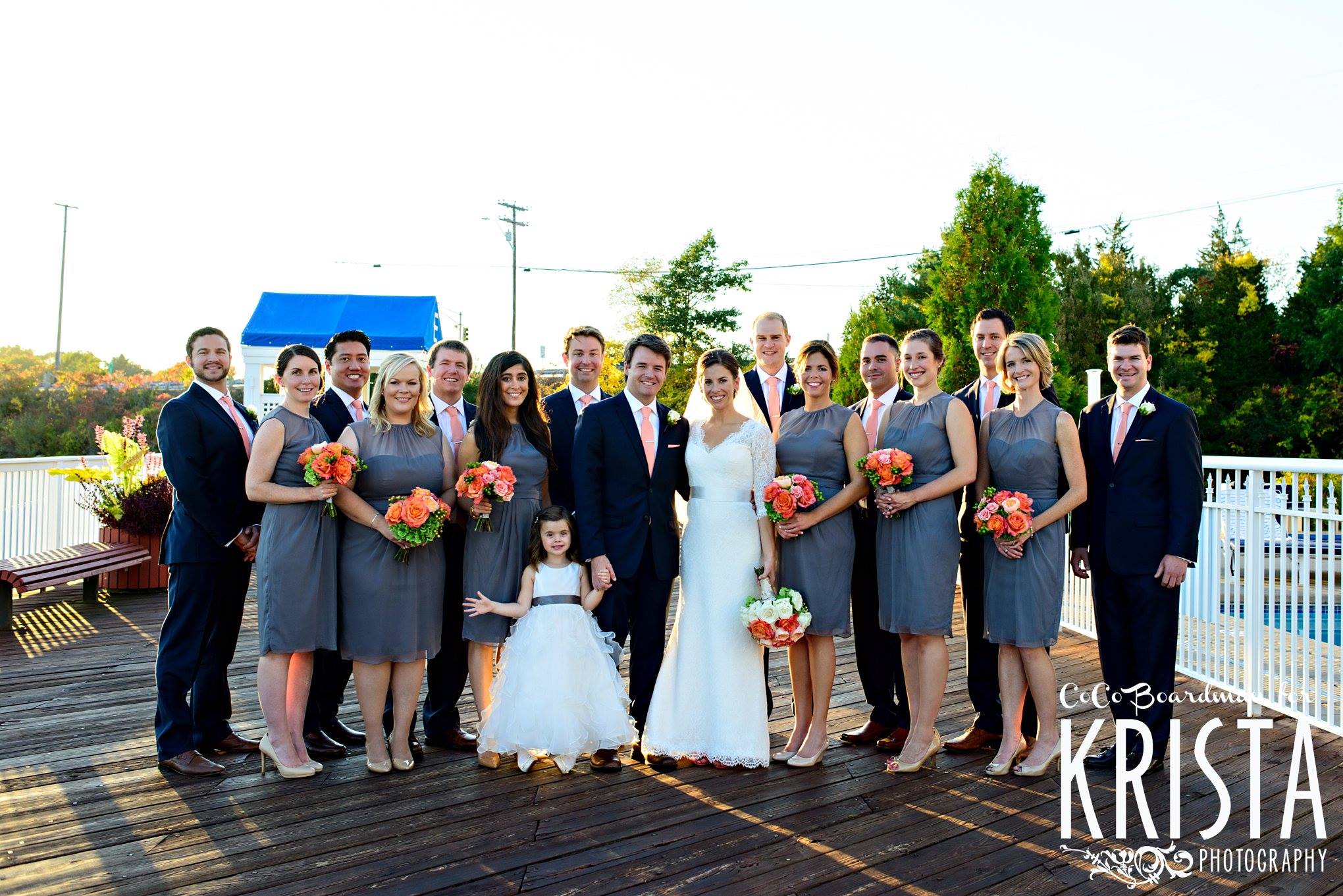 wedding-party-photo-on-dock-wed-on-canvas-coral-bridal-bouquet-gray-bridesmaid-dresses-wentworth-by-the-sea-wedding-ben-keys