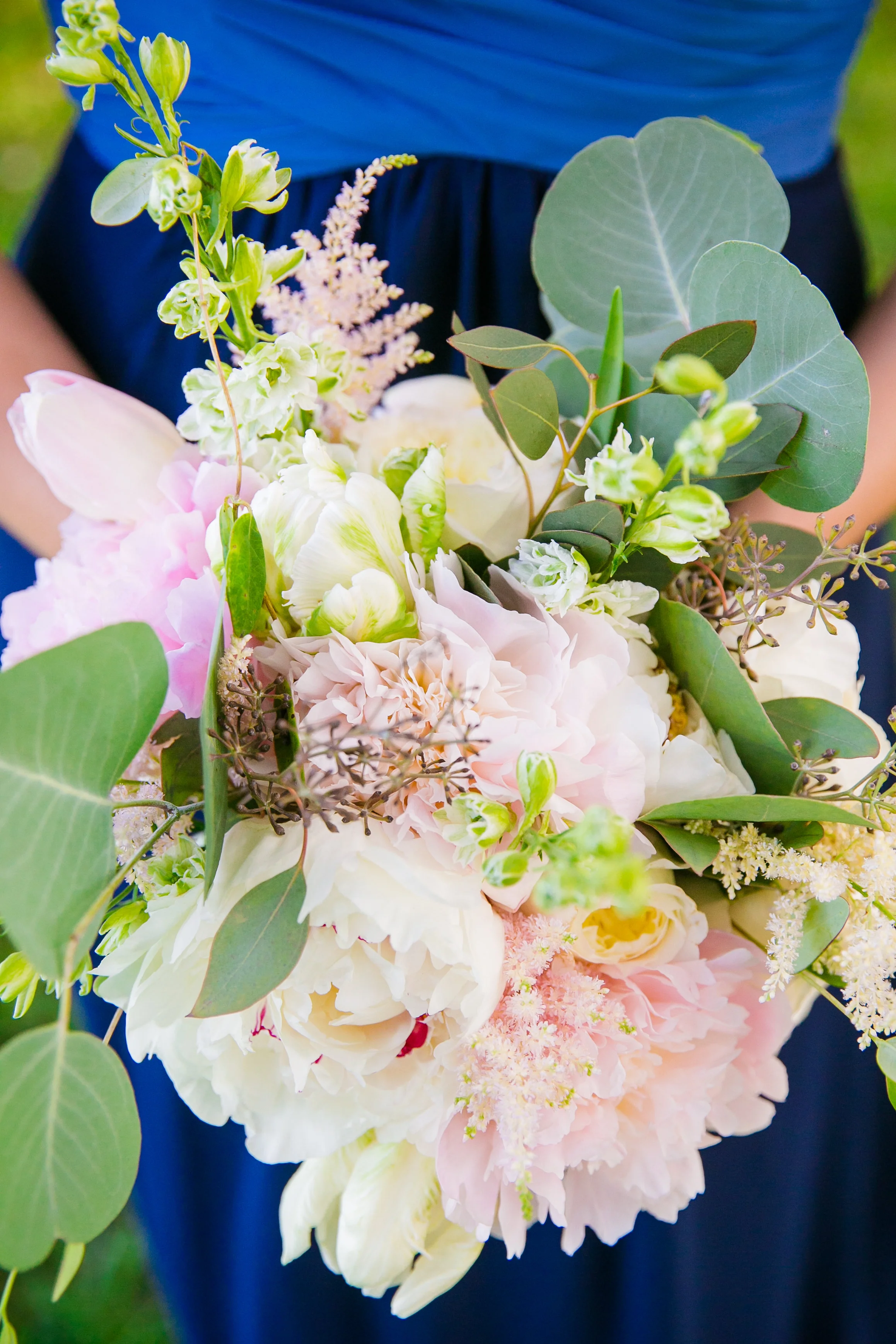 royal-blue-bridesmaids-dress-with-blush-pink-and-white-bouquet