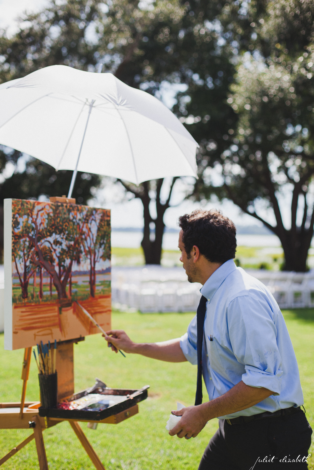 Artist, Ben Keys creating a live painting during Charleston wedding.