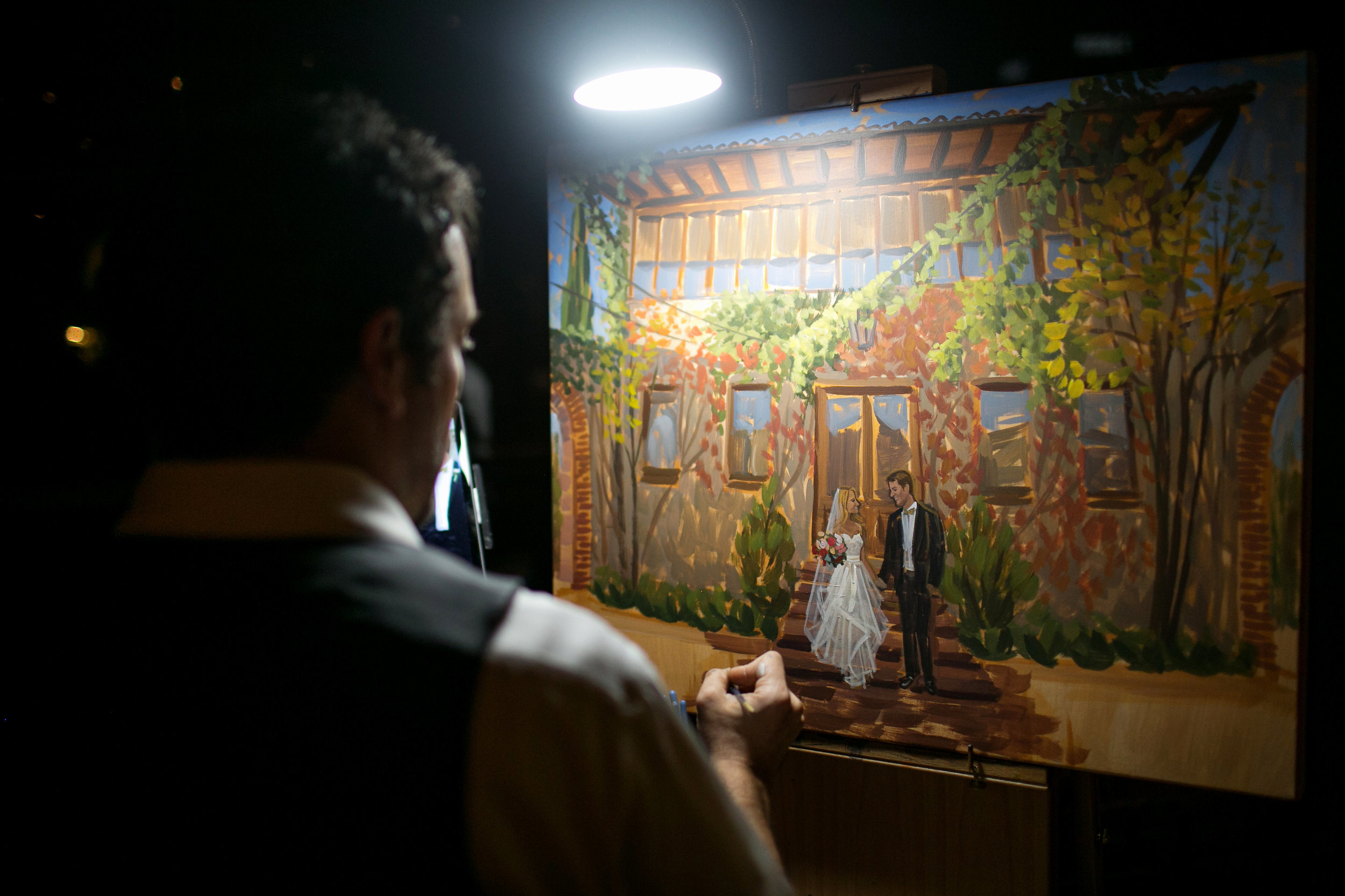 Live wedding painter, Ben Keys, adding the details to Kelsey + Eric's ceremony painting at Summerour Studio in Atlanta.