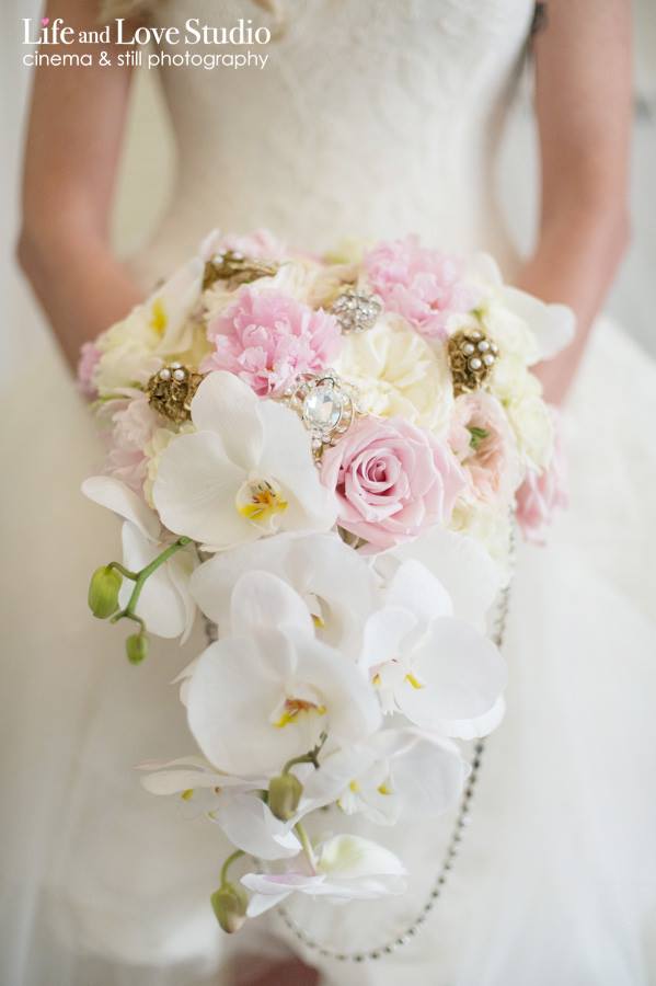 high-low-wedding-gown-with-cascading-orchid-bouquet