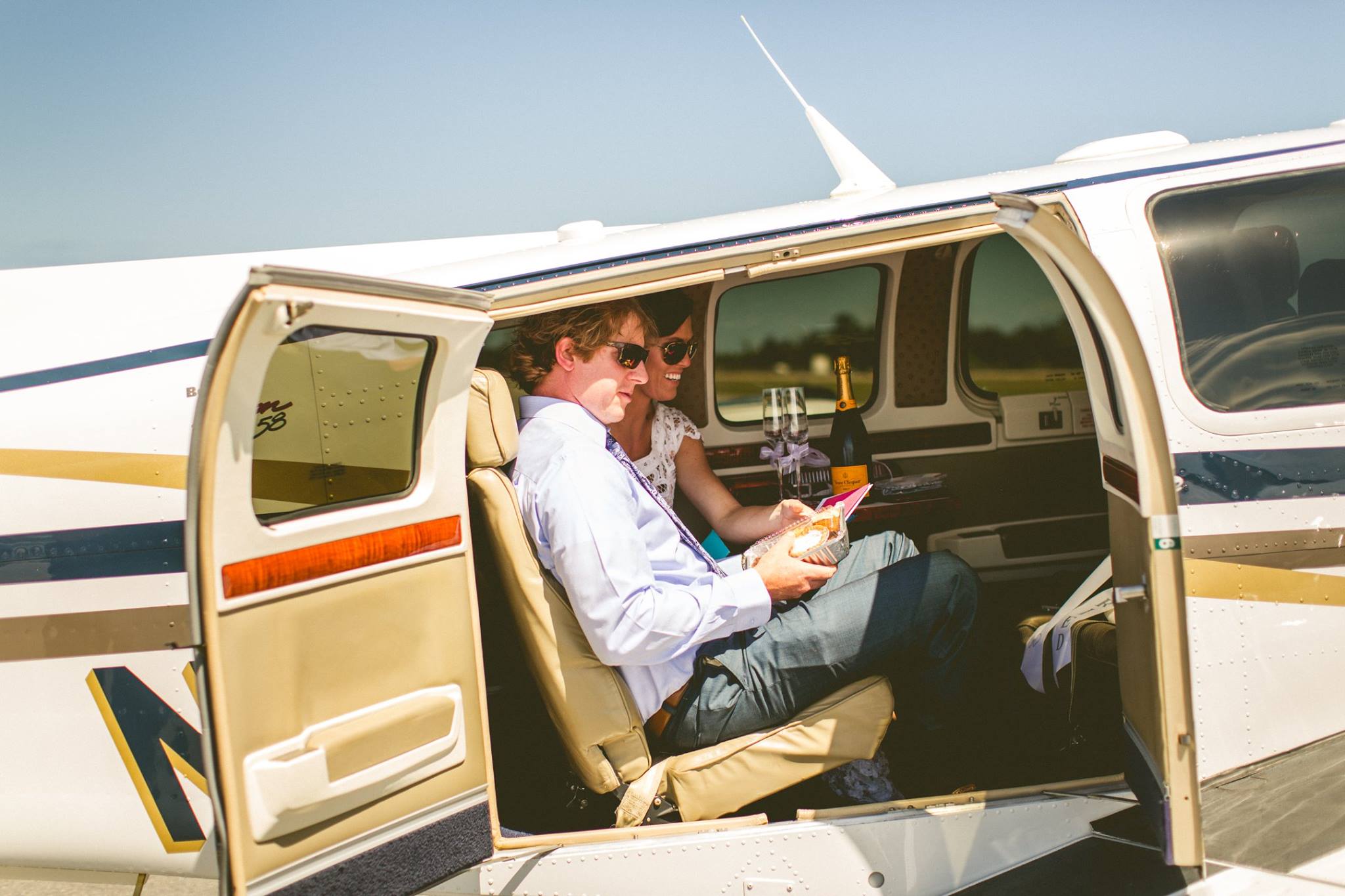 Quite possibly the BEST wedding exit we've ever seen: vintage truck and private airplane!