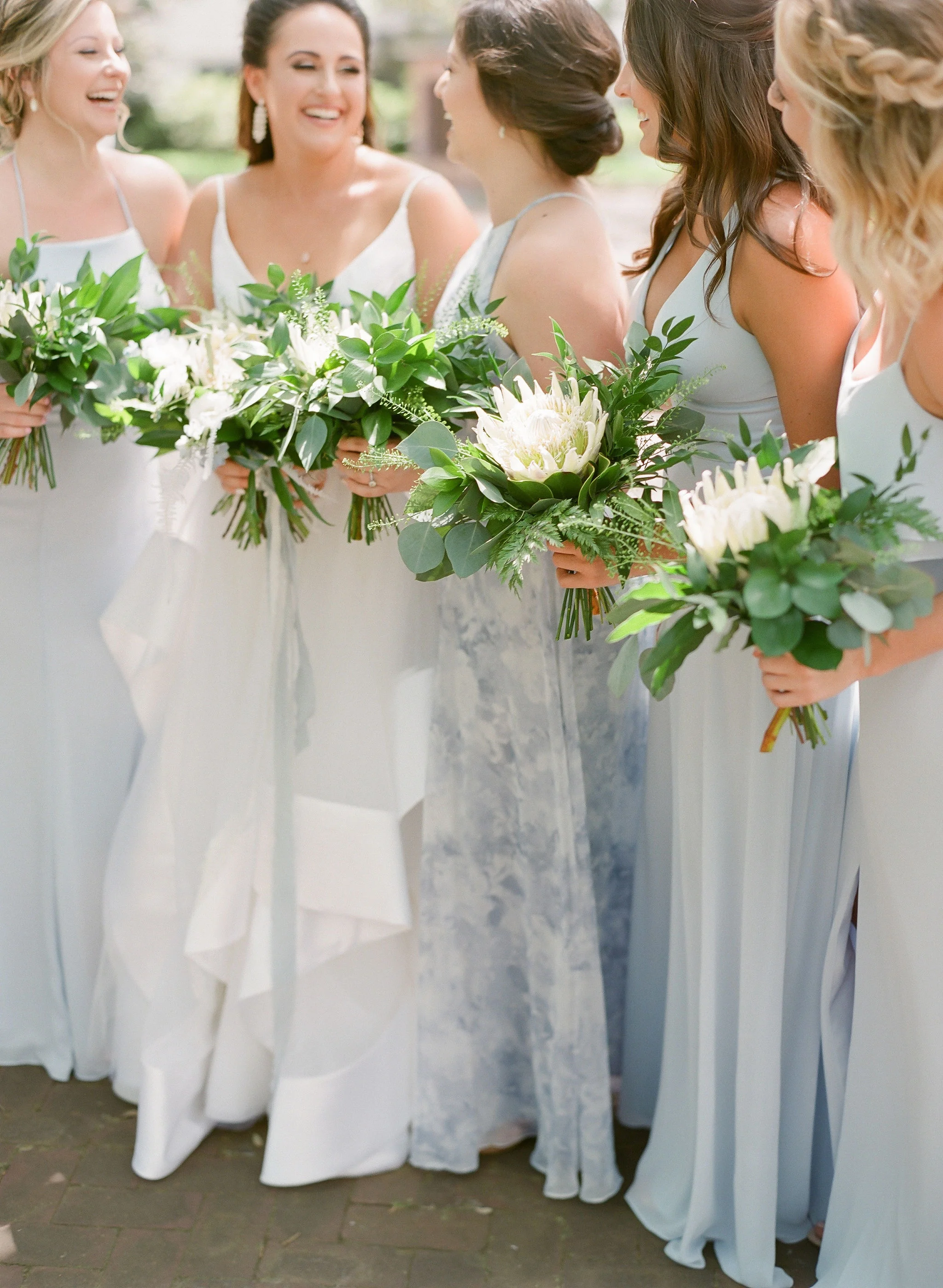 protea wedding bouquet periwinkle bridesmaids